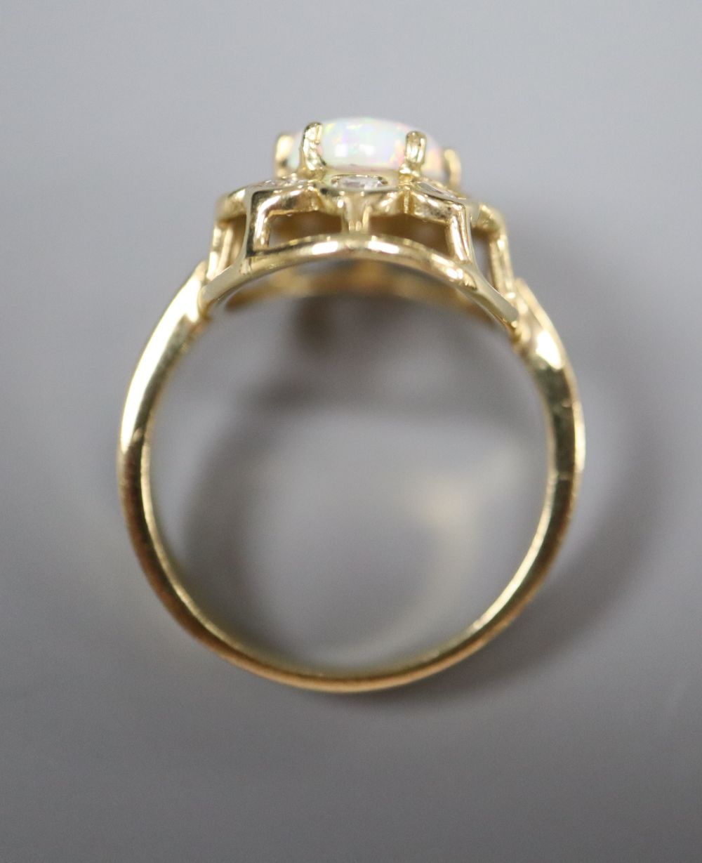 A pair of 585, white opal and paste stud earrings and a similar paste-set bracelet and ring ensuite, gross 21.6g.